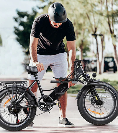 Person folding a black e-bike